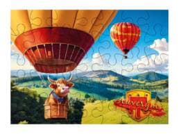 Puzzle 100 pièces souvenir Auvergne illustré d'une vache en montgolfière
