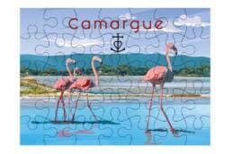 Puzzle 100 pièces souvenir Camargue représentant des flamants roses dans les étangs