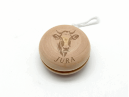 Yoyo en bois souvenir Jura gravé d'une vache et du nom Jura