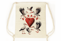 Sac pochon souvenir Alsace avec cigognes et cœur alsacien
